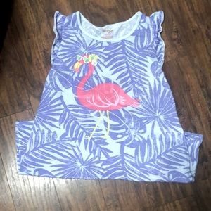 A nightgown in a  purple with a flamingo on the front, a  stain on the front.